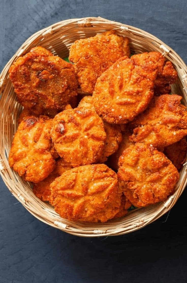 Homemade Bihari thekua in a bamboo basket
