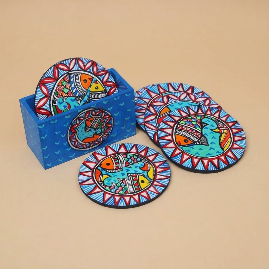 Set of six wooden coasters featuring traditional Madhubani fish artwork